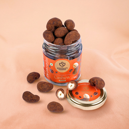 Open milk chocolate coffee cashew jar with scattered cashew pieces