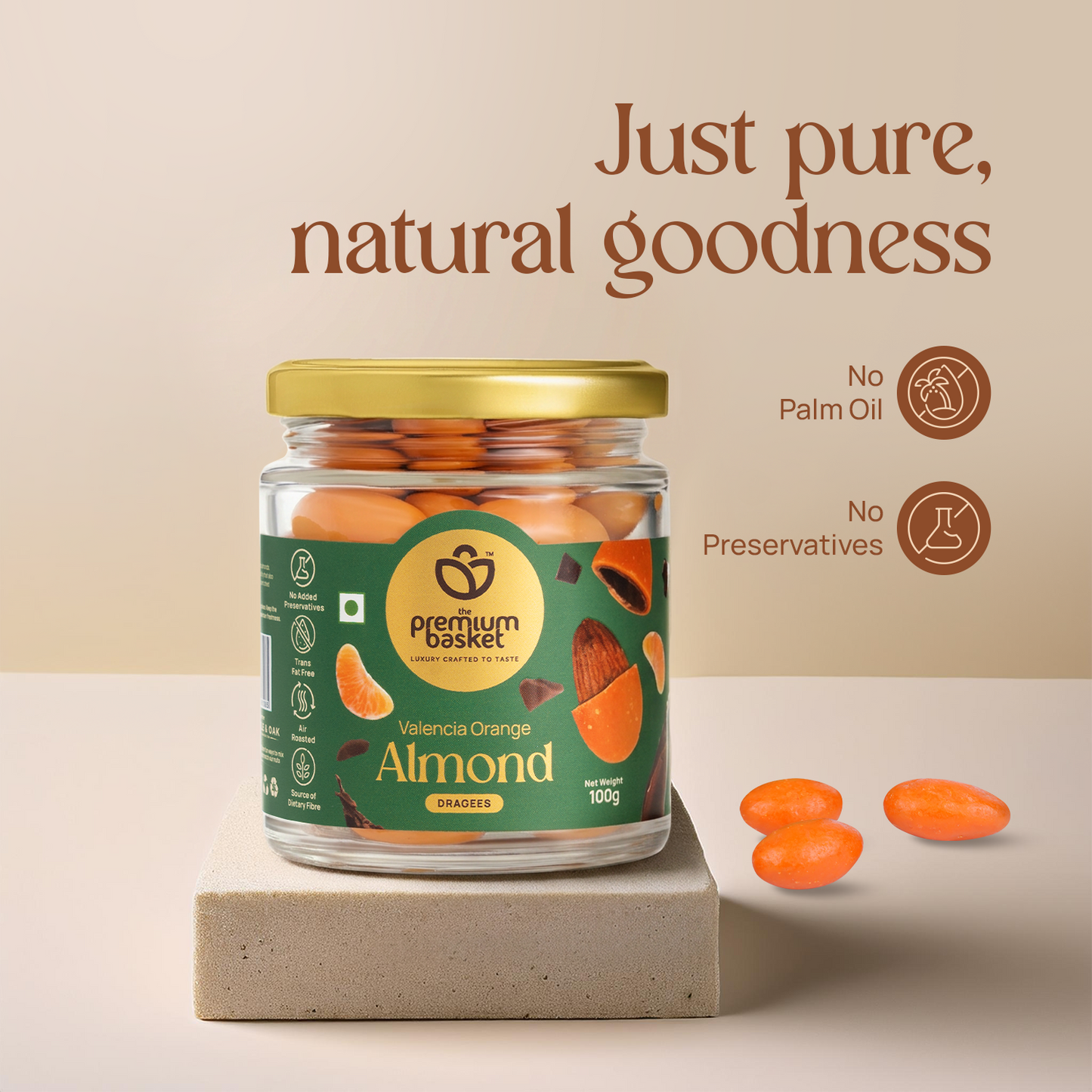 Valencia Orange Almond jar with gold lid and orange almonds beside it