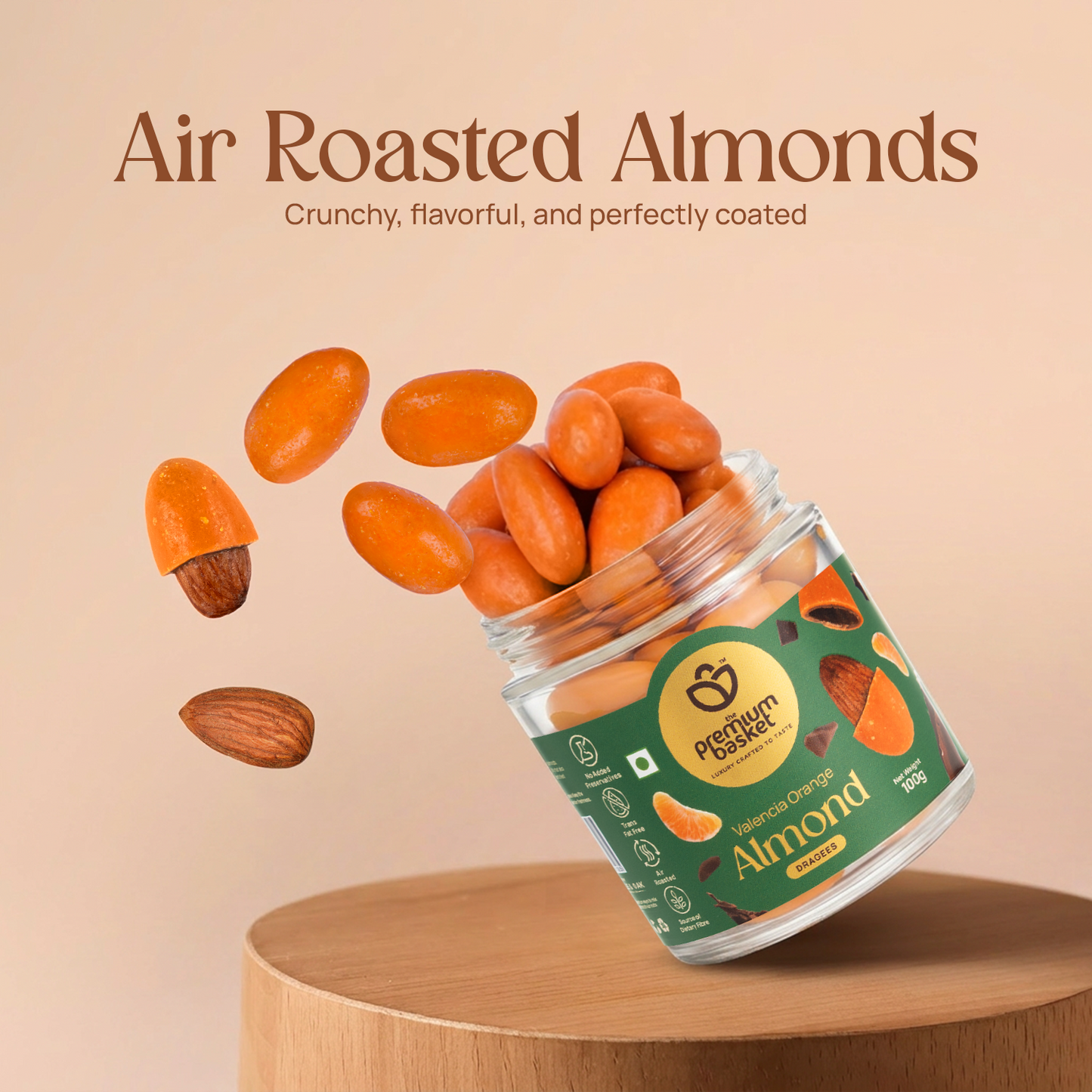 Glass jar of Valencia Orange Almonds tipped with orange coated almonds