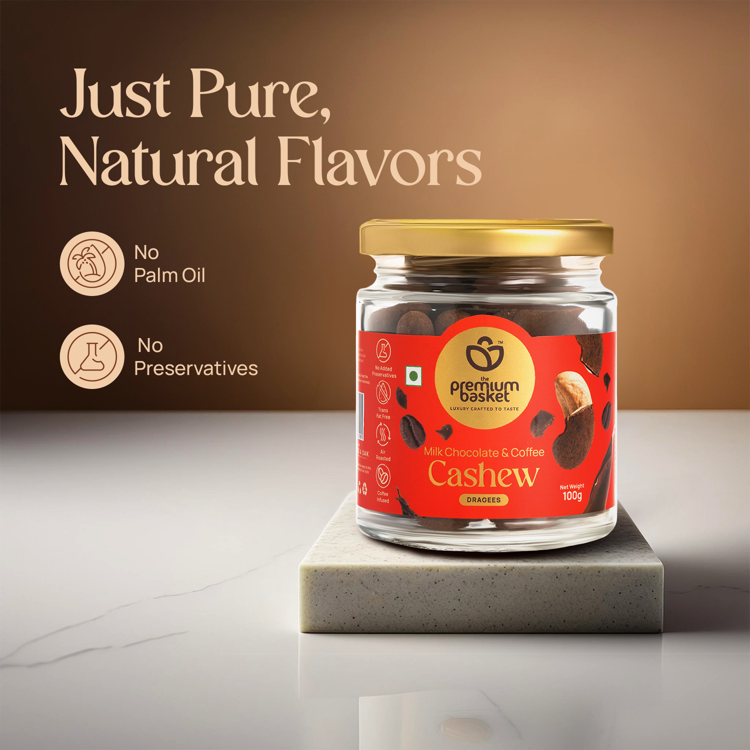 Milk chocolate coffee cashew jar with gold lid on a white pedestal
