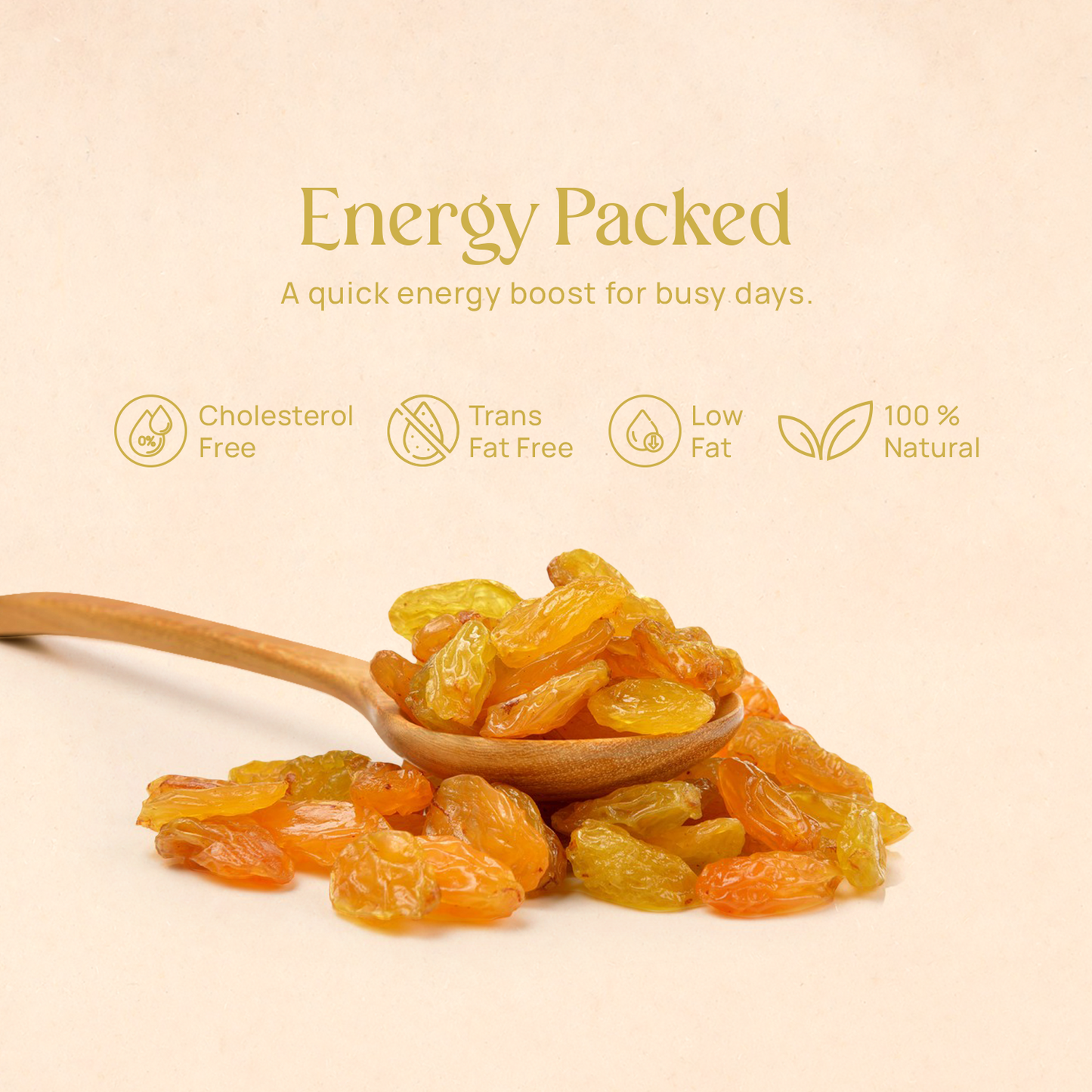 Pile of golden raisins with a wooden spoon on a flat surface