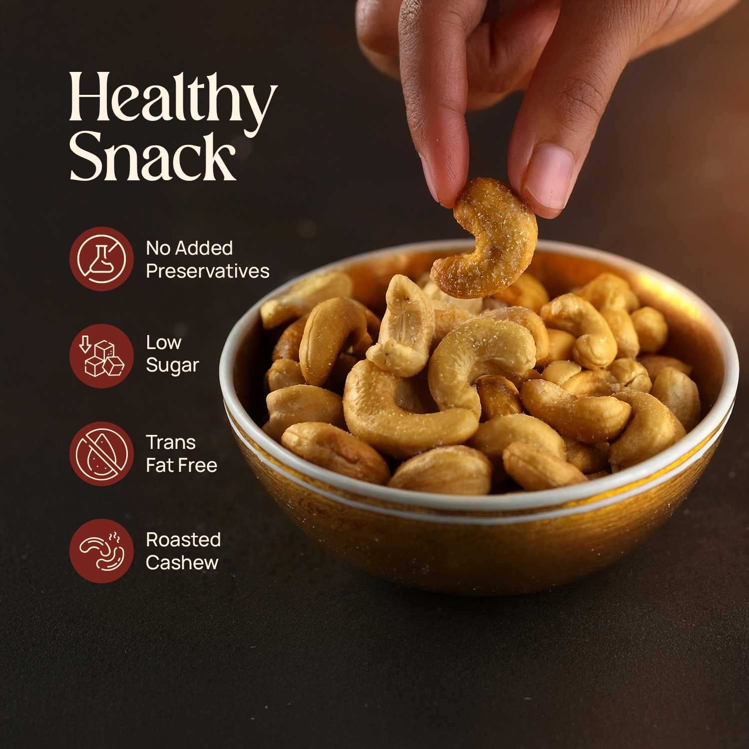 Hand holding roasted cashews over a bowl with “Healthy Snack” badges