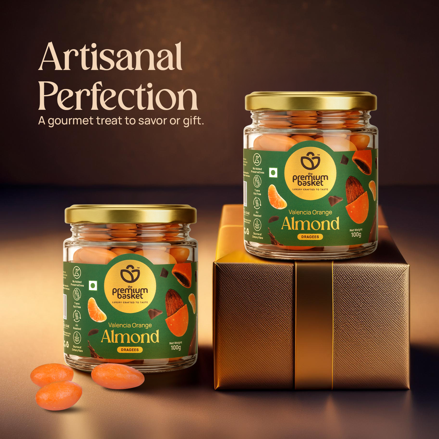 Valencia Orange Almond jars with gold lids stacked on a gift box
