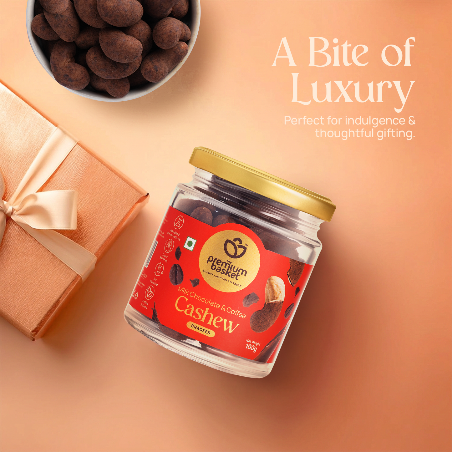 Milk chocolate coffee cashew jar with gold lid and cashews nearby
