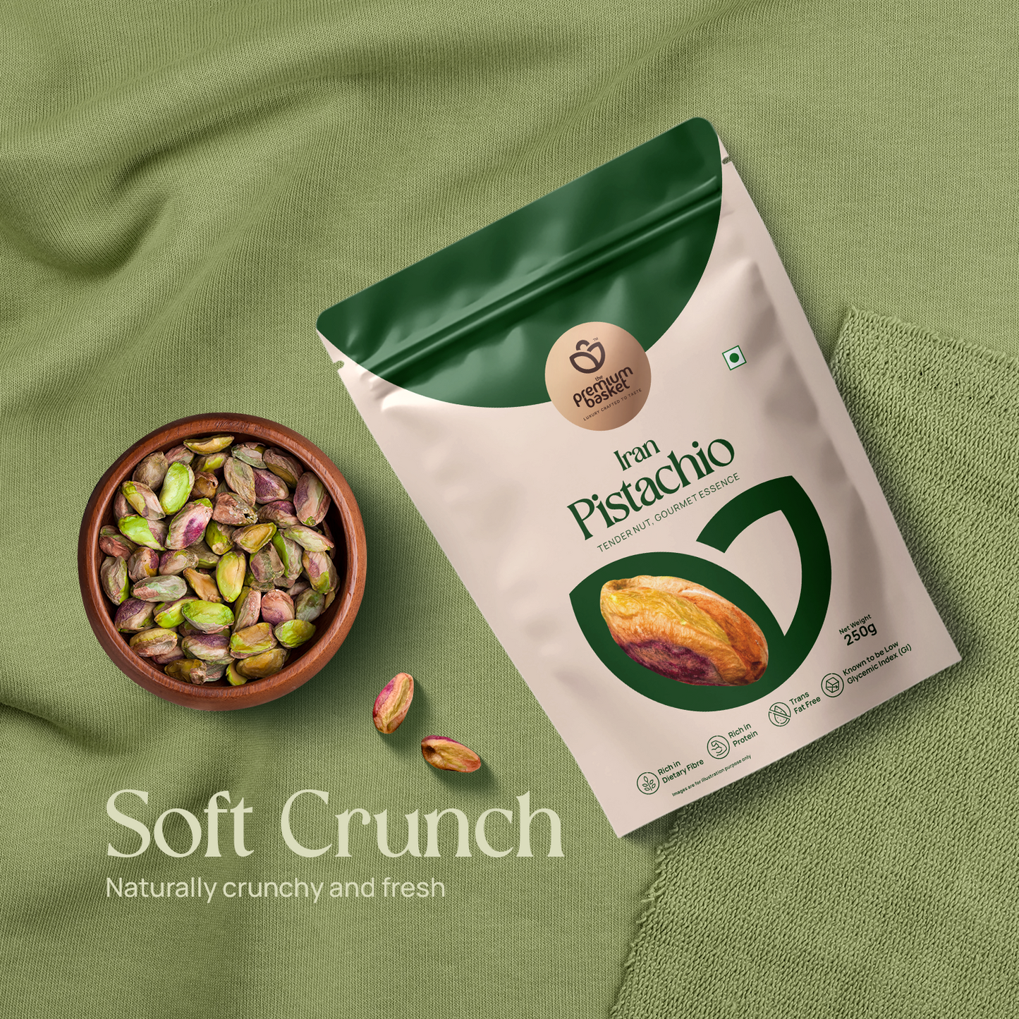 Pistachio kernels bag with a bowl of mixed green and purple pistachios beside it
