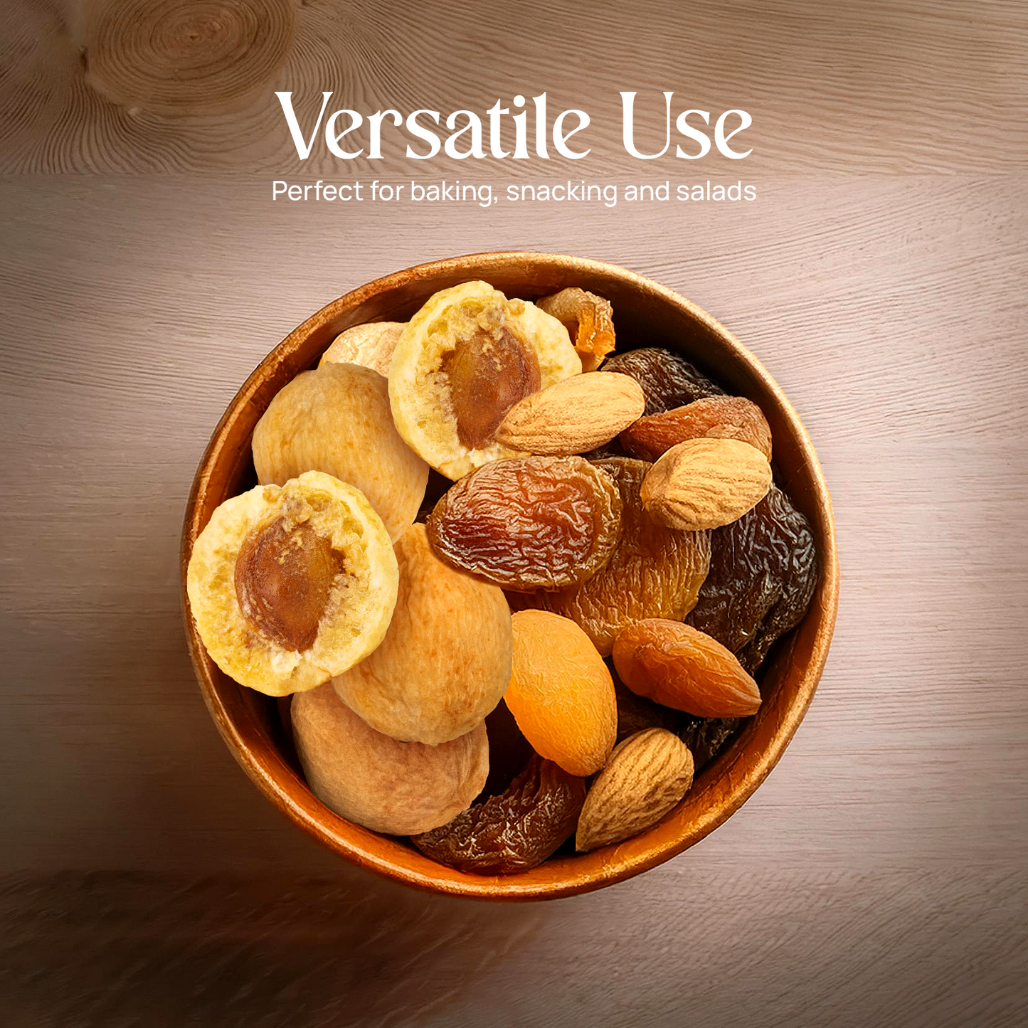 Bowl of dried fruits including golden apricot pieces and a halved apricot