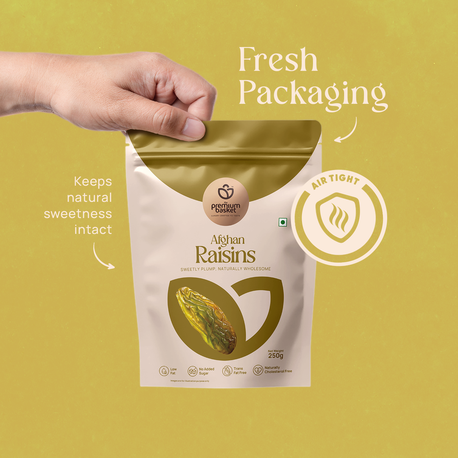 Hand holding a stand-up raisins pouch with gold foil top