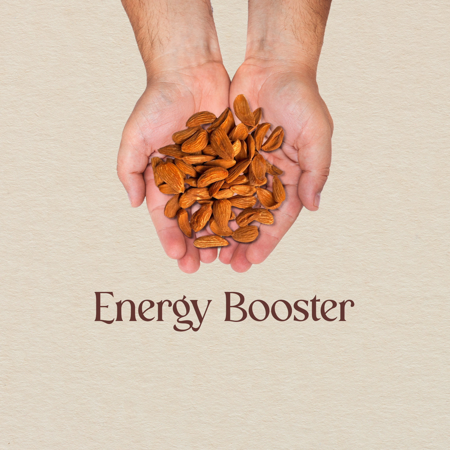Hands holding a pile of golden-brown almond kernels