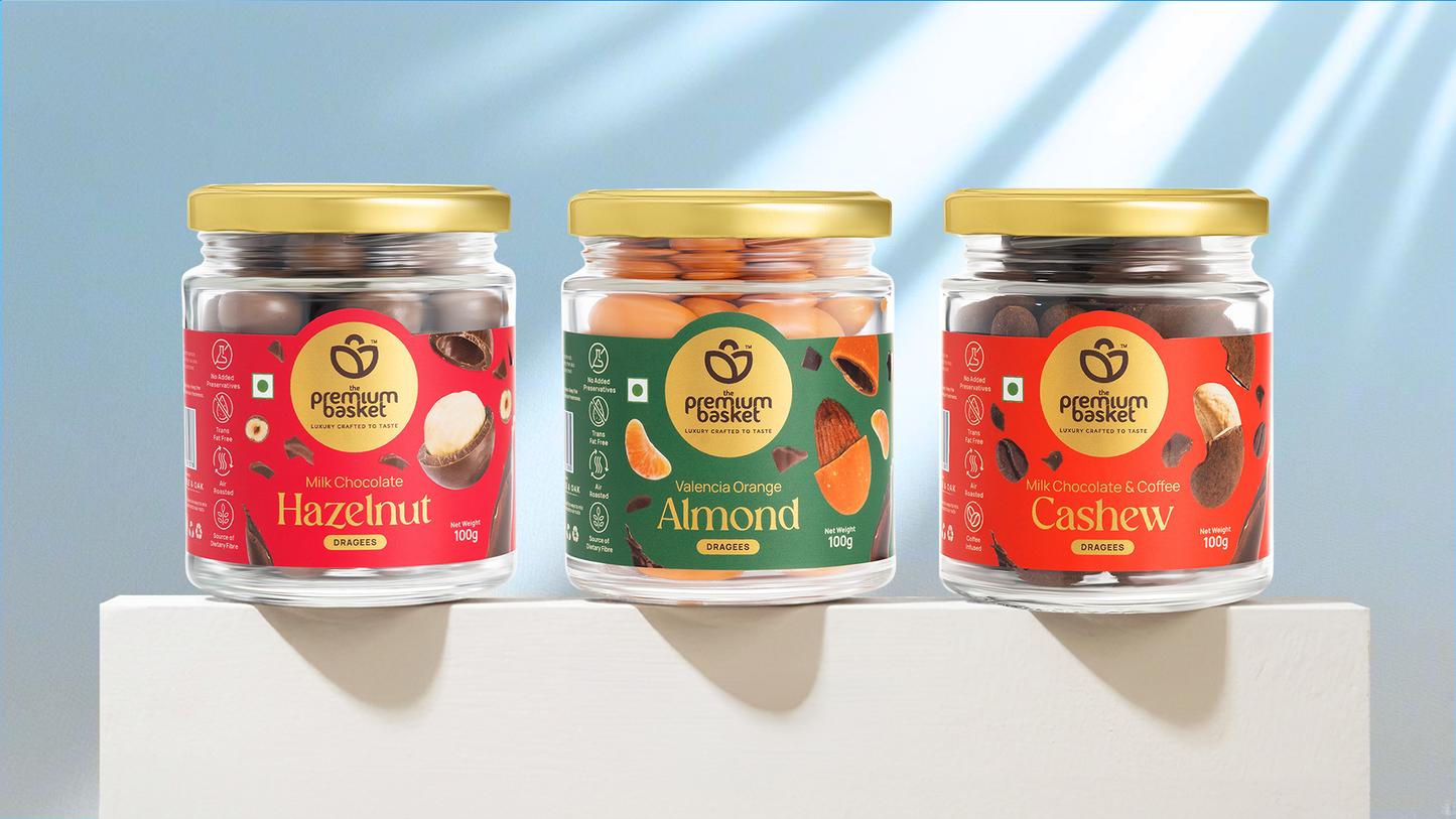 Assorted dragee jars: Hazelnut, Valencia Orange Almond and Cashew in milk chocolate