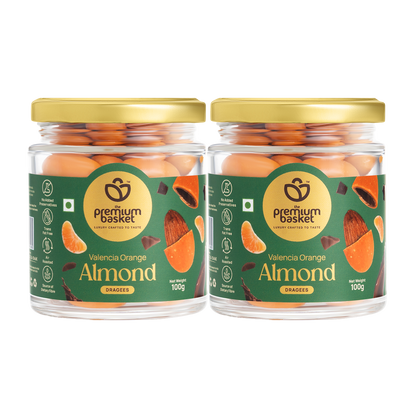 Two Valencia orange almond jars with gold lids and green labels